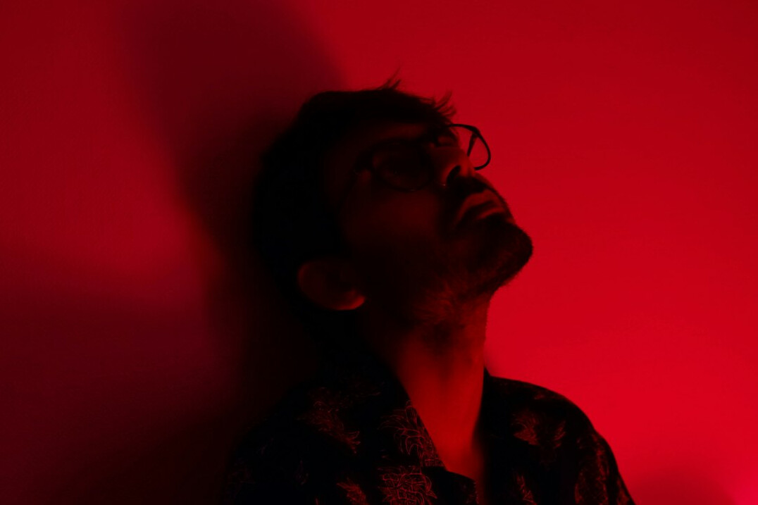 Studio portrait of a man with glasses and a beard